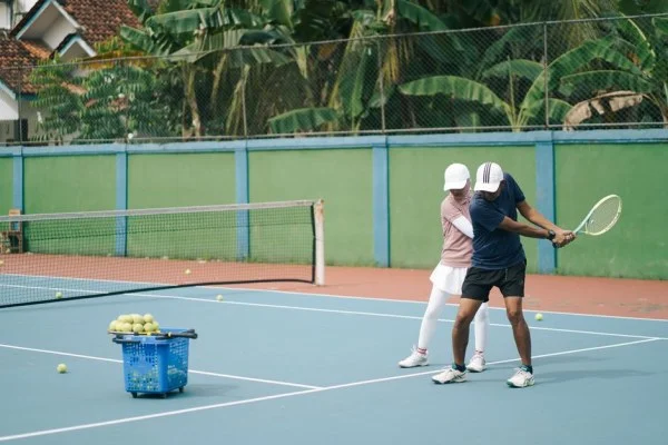 tennis coach and player